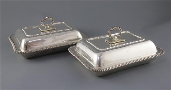 A pair of George V silver entree dishes, cover and handles, by Harrods Stores Ltd, 110 oz.